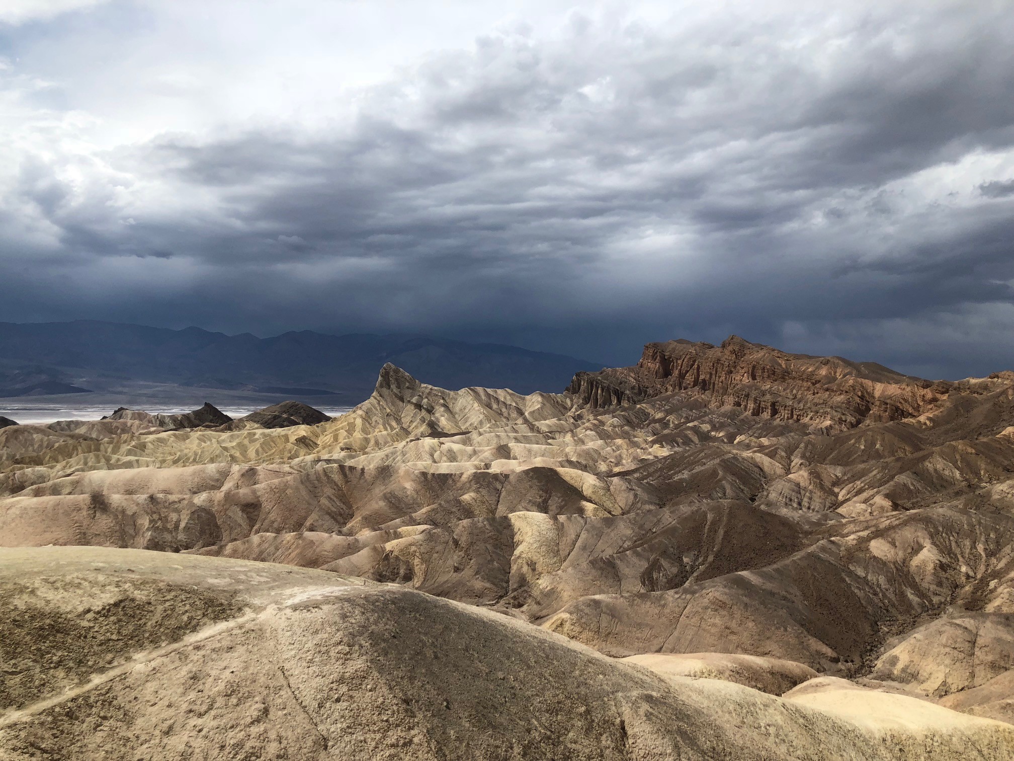 overcast sky above rock outcropping in desert
