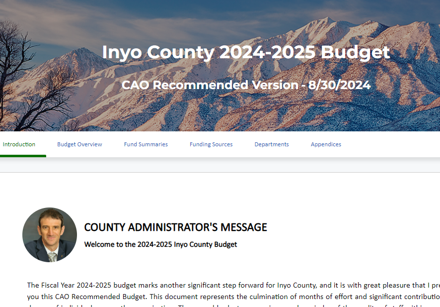 Screenshot of digital budget book with mountain scenery at top and message from CAO at bottom