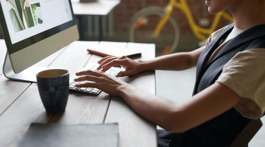 Woman at desk on laptop computer