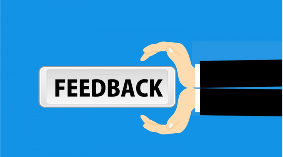 Hands holding feedback paper