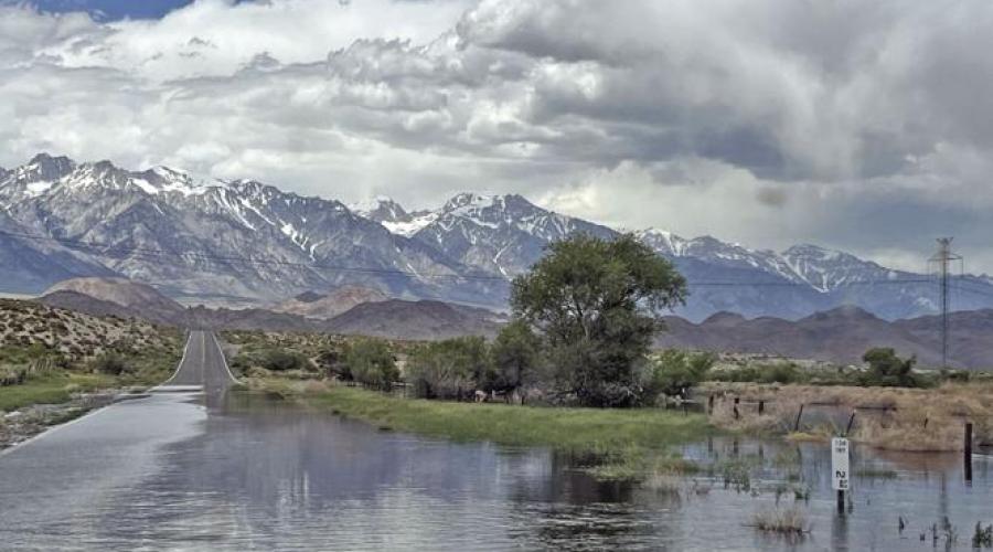 Water flooding a desert highway.