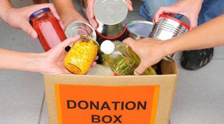 Multiple hands placing food items in a box labeled Donation Box.