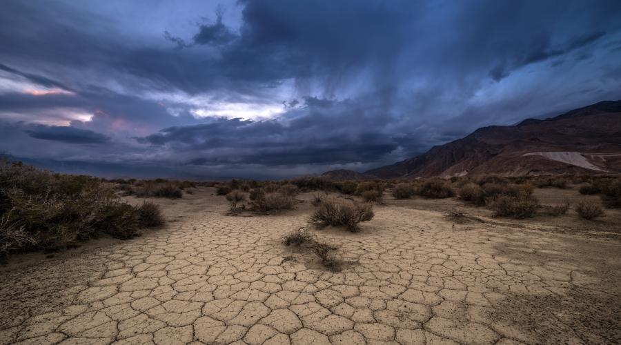 Storm clouds over a desert playa.