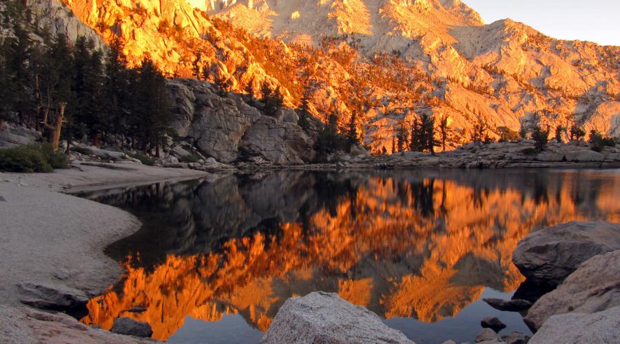 Sunrise over alpine lake