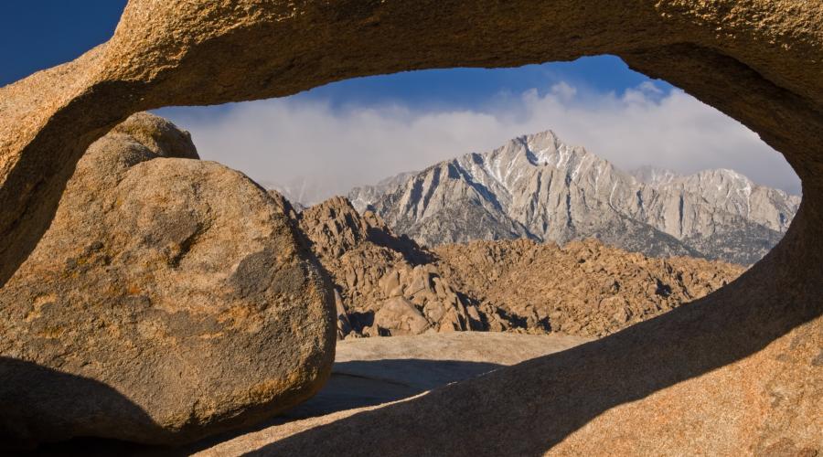 Mt. Whitney as seen through a stone arch in the Alabama Hills