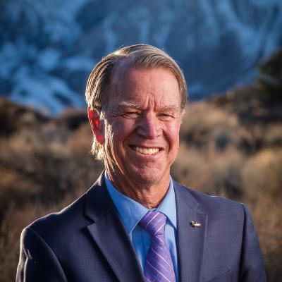 Man in Suit in Mountains