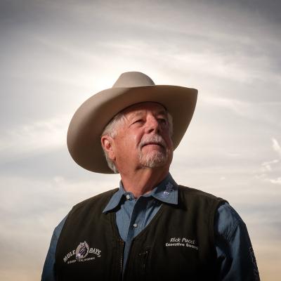 Man in Cowboy Hat Gazing Off Into the Distance