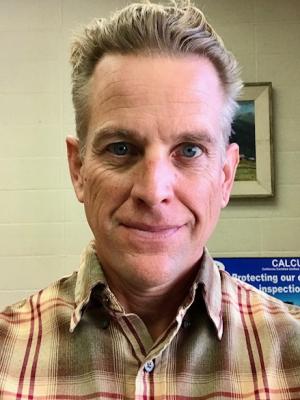 Jerry Oser profile picture in brown plaid shirt.