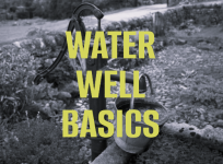 Photo of a historic hand-pump operated well with bucket