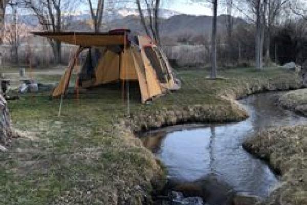 Picture of tent by stream at Millpond campground